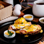 Egg Royal with smoked salmon and hollandaise in Shoreditch near Old Street – popular brunch dish (皇家鸡蛋) (huevos royale) (œufs royal) (royale frühstück) (エッグロイヤル) (uova royale).